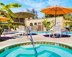 Relaxing pool area at Circle RV Resort featuring a hot tub